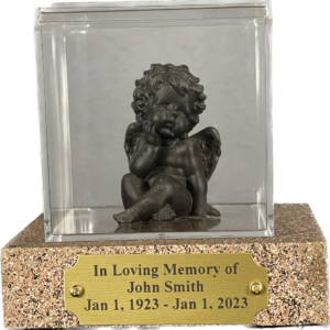 Cremation ash figurine crafted from the cremated remains of a loved one, leaning serenely in a cross-legged position, on a wooden base with acrylic case and engraved plaque